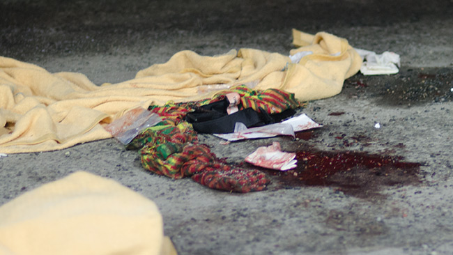 Fotot är taget vid bensinstationen i Fittja där den skjutne mannen blev hämtad med ambulanshelikopter. Foto: Nyheter Idag